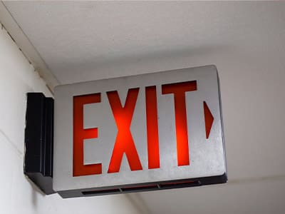 red exit sign attached to wall